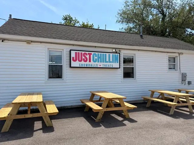 The Just Chillin' patio sign beside the outdoor seating area